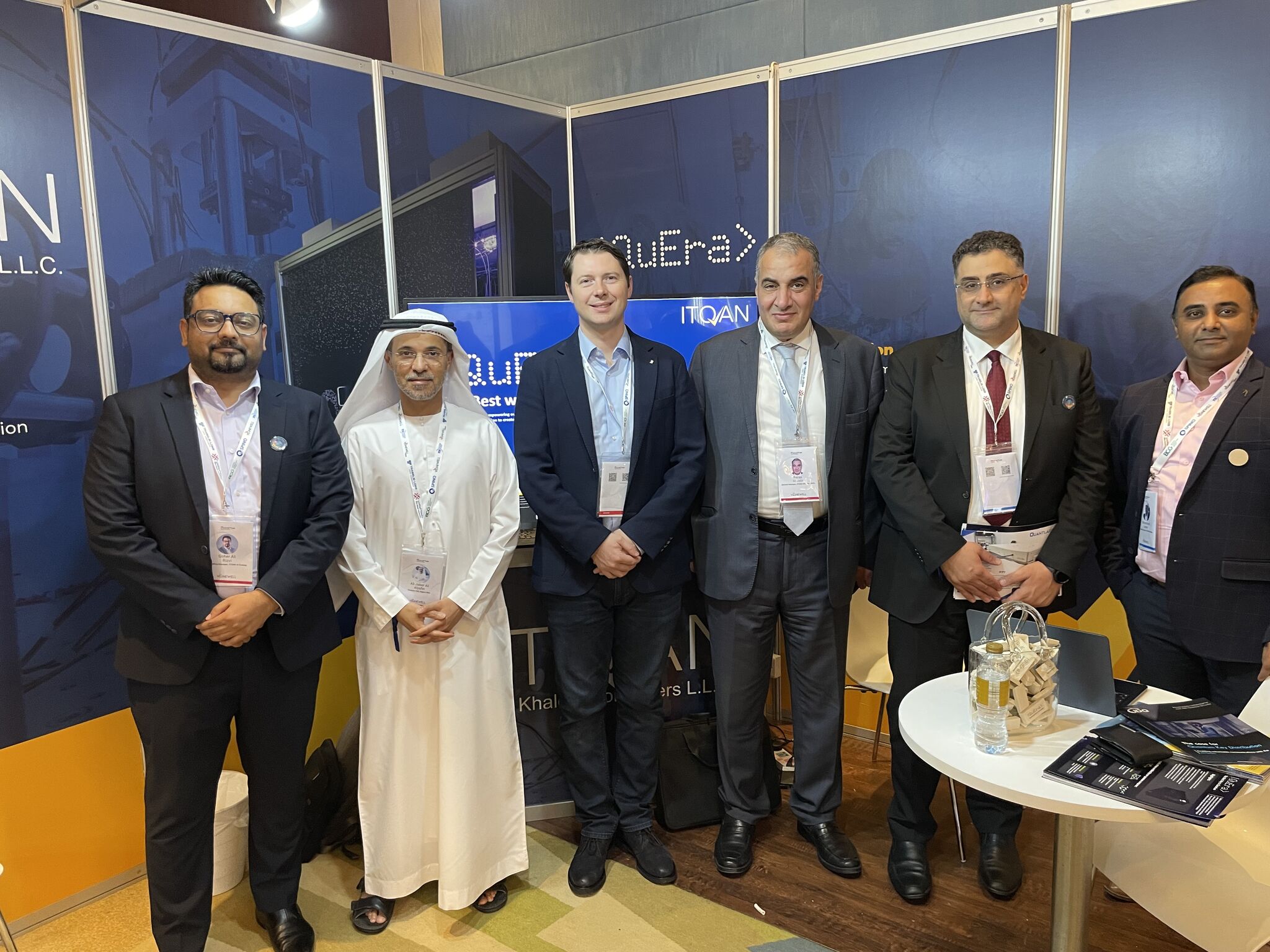 ITQAN Al Khaleej booth at Quantum Innovation Summit in partnership with QuEra. Ali Jaber Al Yafei, Feras Al Jabi, Bassem Moustafa, Mohamed Aslam and Marketing Manager Goher Ali Rizvi are in picture